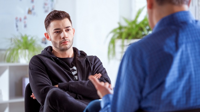 Young man in brief psychotherapy session